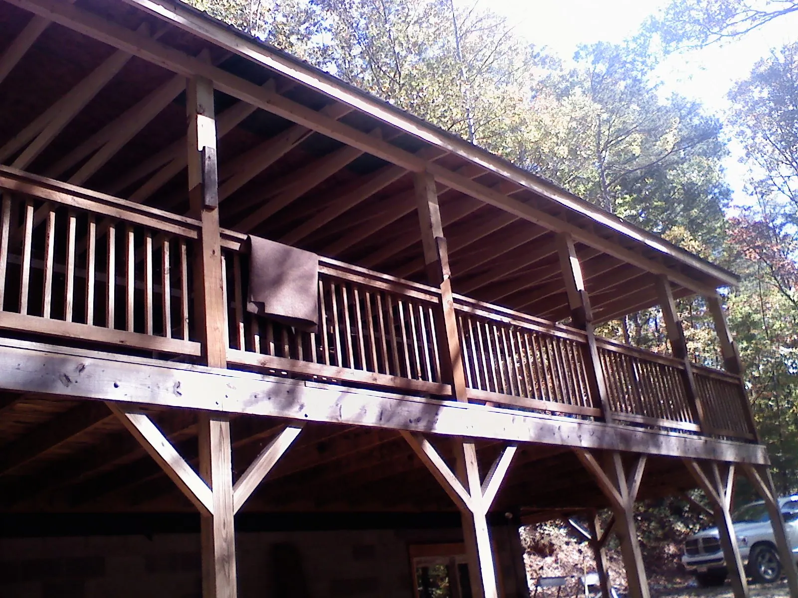 Timber framing under a new elevated porch and deck — Roof Leak Repair in Carlos by Roofing Brothers